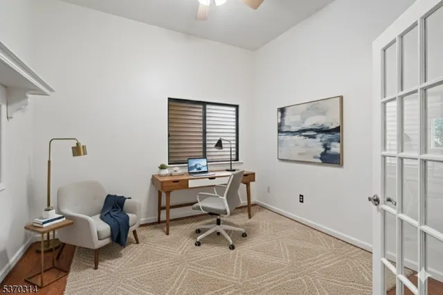 a workspace with furniture and window