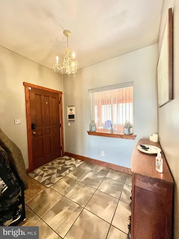 a kitchen with stainless steel appliances granite countertop a stove a refrigerator and a sink with wooden floor