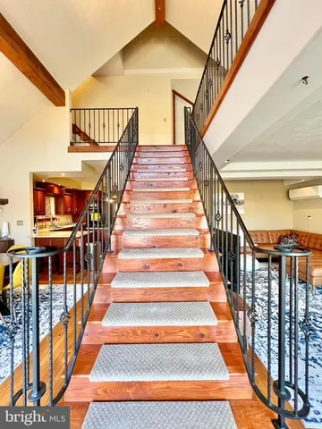 a bathroom with a double vanity sink toilet and a mirror
