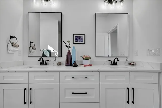 a bathroom with a shower a toilet and sink