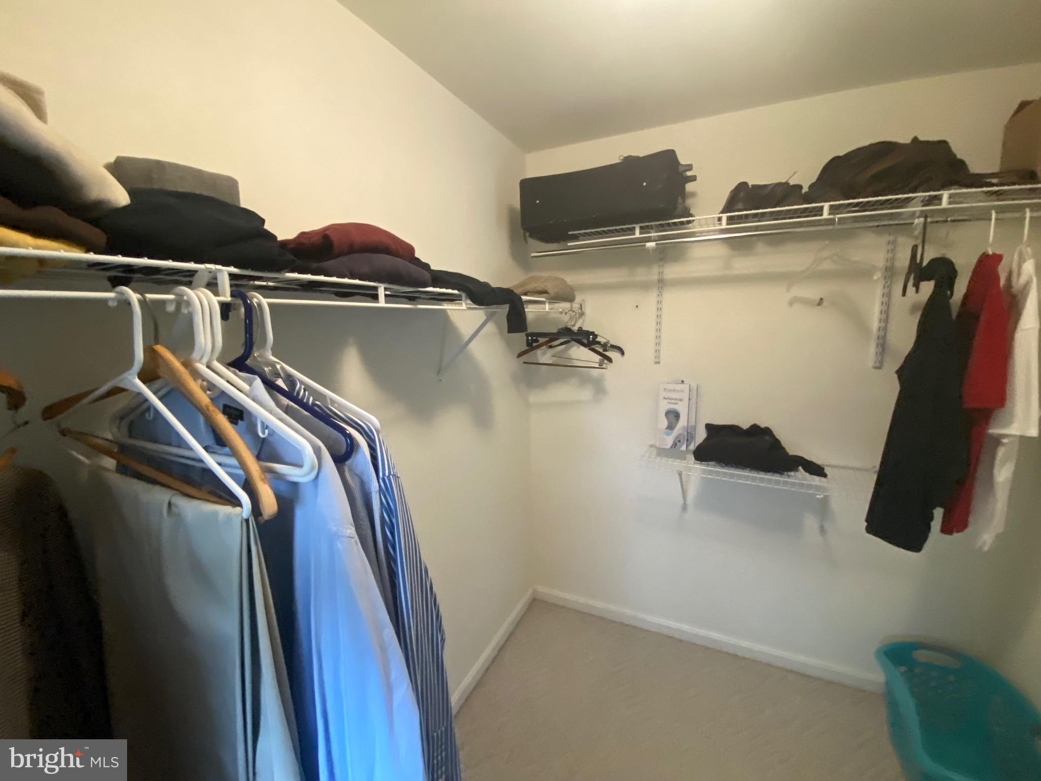 13 Fairway Avenue Georgetown, DE 19947 - Photo 12 of 37 a view of walk in closet with clothes and shoes