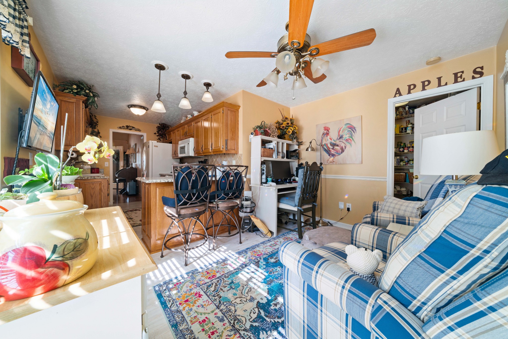 425 Fowler Ford Road Portland, TN 37148 - Photo 14 of 40 a living room filled with furniture and a chandelier