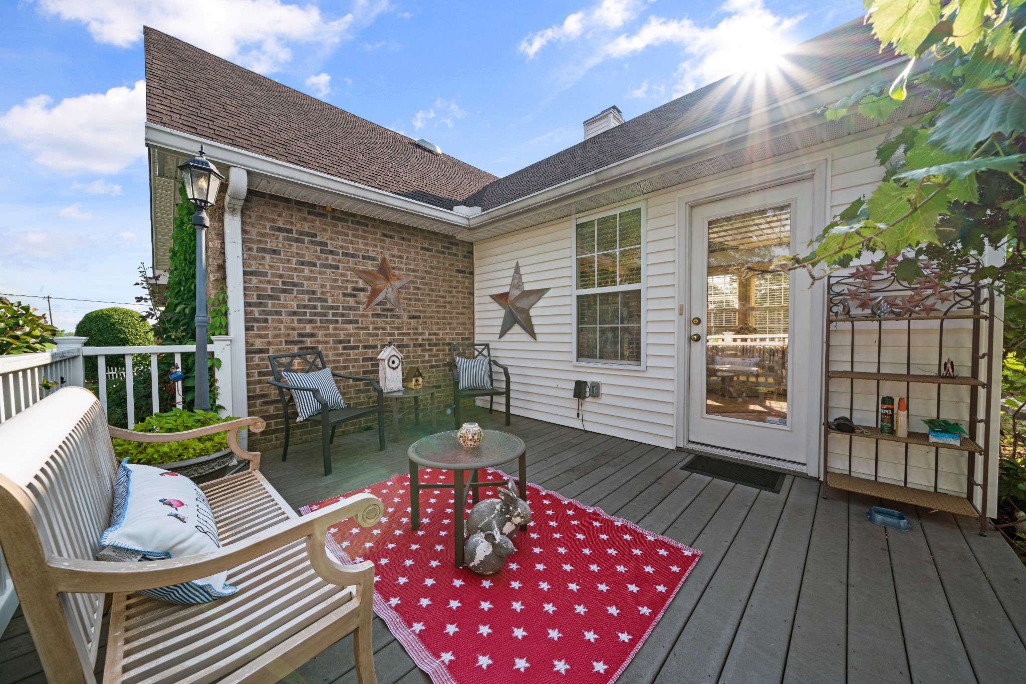 425 Fowler Ford Road Portland, TN 37148 - Photo 5 of 40 a view of a patio with couches chairs and wooden floor