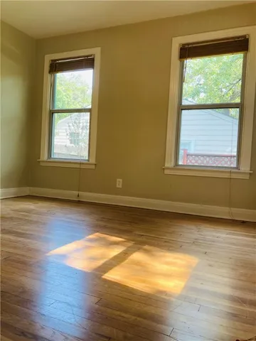 a bathroom with a tub a toilet and a shower