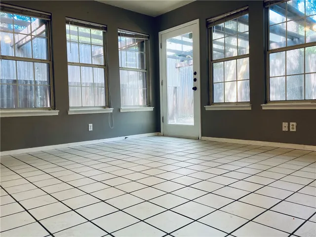 a view of an empty room and window