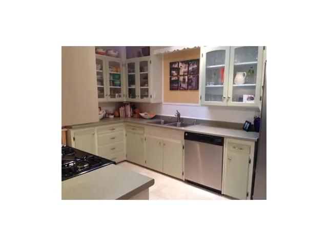 a bathroom with a toilet and a mirror