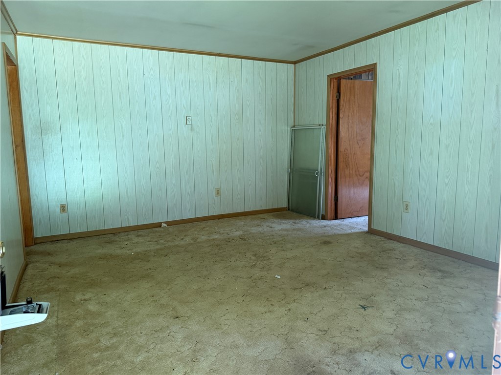 6509 Hines Road Disputanta, VA 23842 - Photo 15 of 22 Room featuring light-toned vertical paneling with