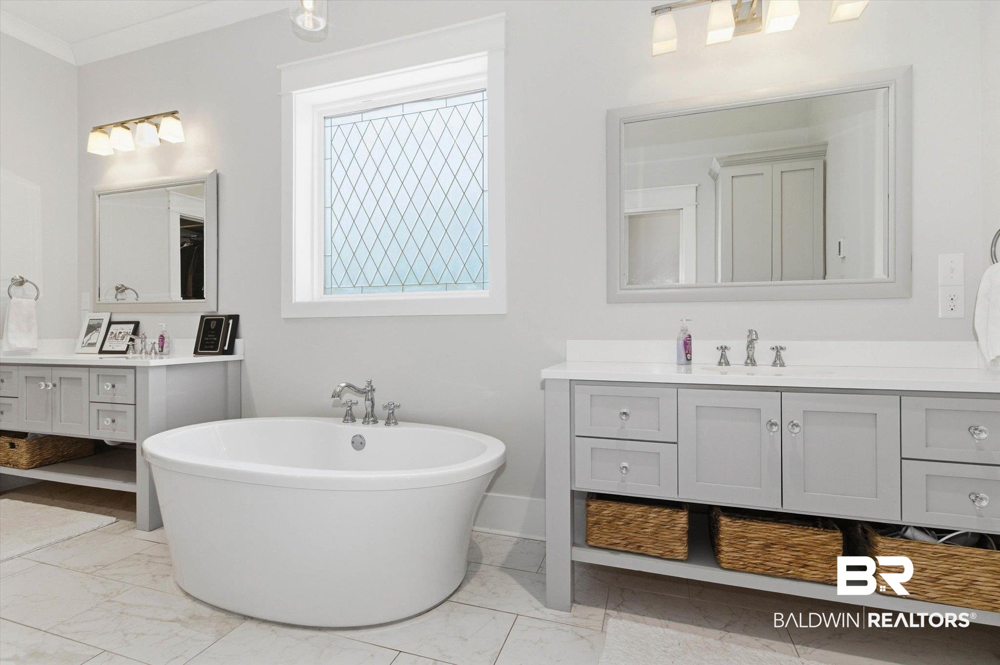 3704 Stein Street Mobile, AL 36608 - Photo 16 of 37 Full bath featuring two vanities, light marble finish floors, and a freestanding bath