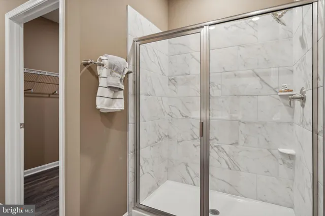 a bathroom with a glass shower door