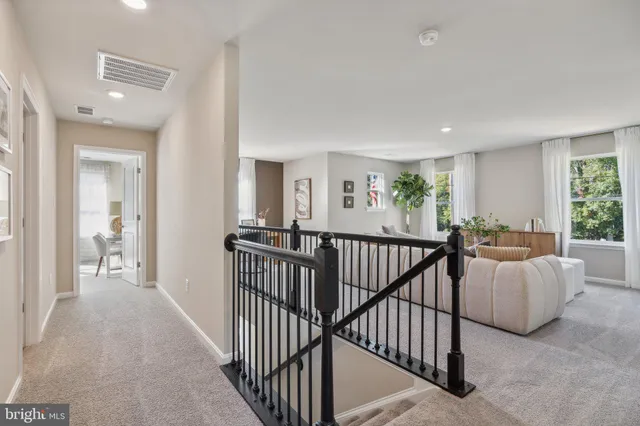a view of a bedroom with furniture and windows
