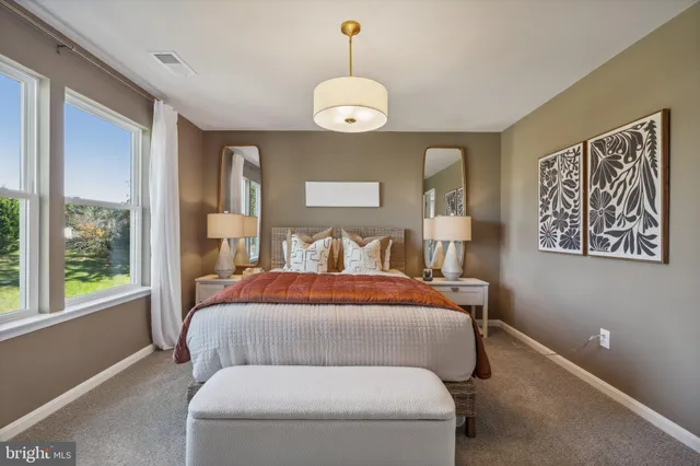 a bed room with bed and window