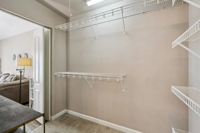 a view of a bathroom with a shower and a sink