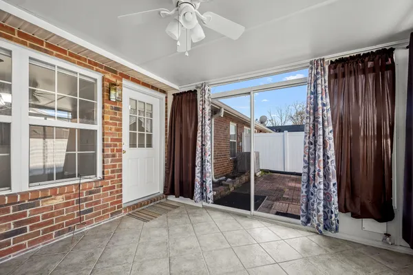 a view of empty room with large windows