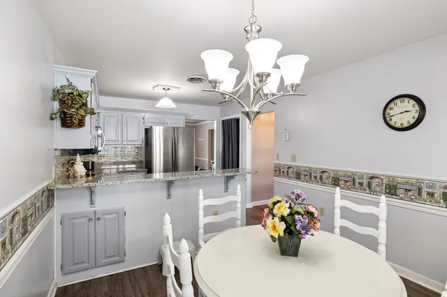 a kitchen with a table and chairs