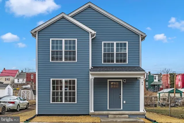 a front view of a house with a garage