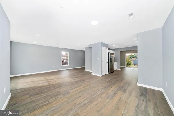 a view of a livingroom with wooden floor