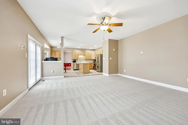a view of a livingroom with a kitchen