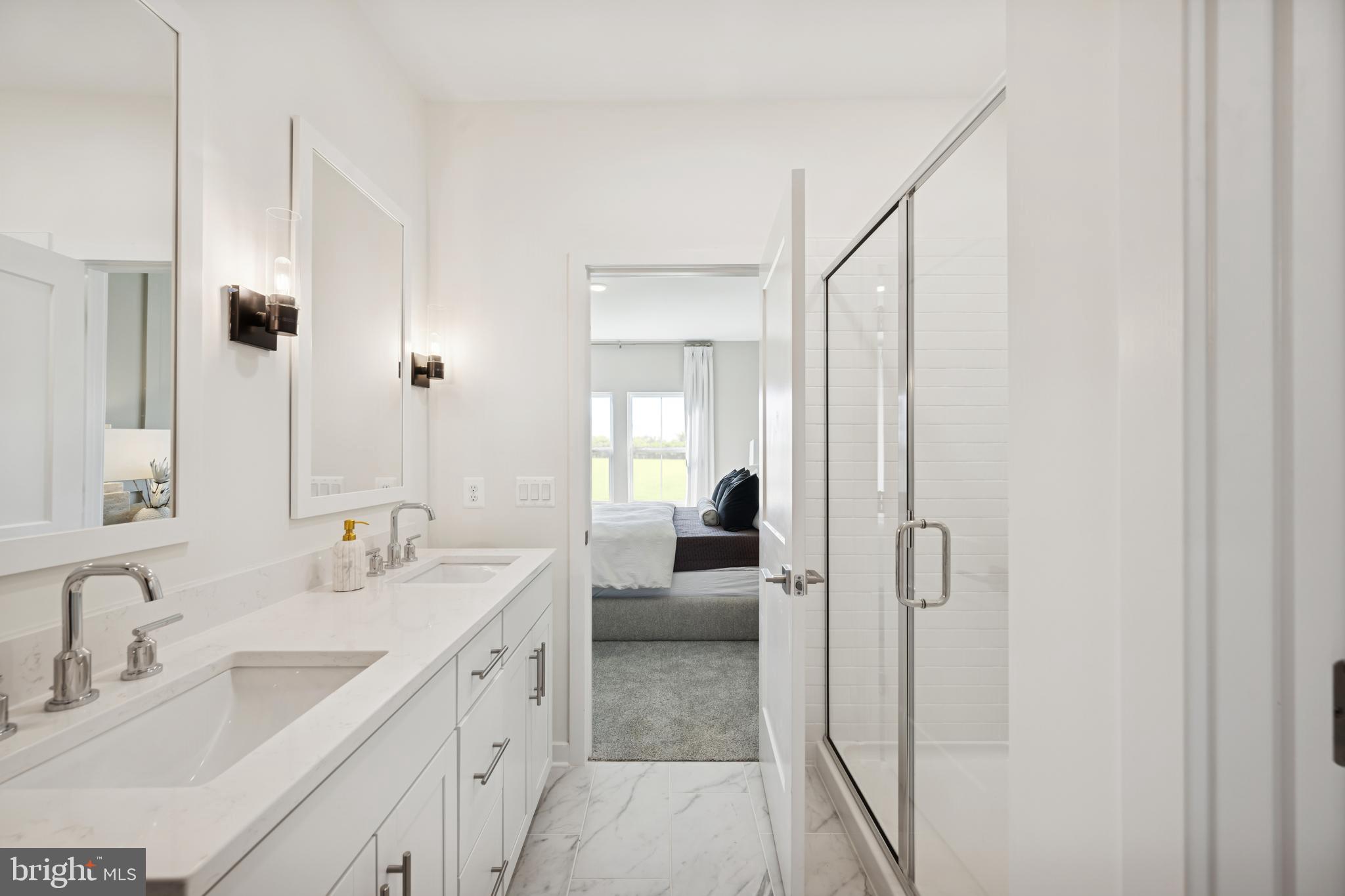 (lot 414-tbd Lot 414-tbd Street Ranson, WV 25438 - Photo 8 of 16 a spacious bathroom with a double vanity sink a mirror and shower