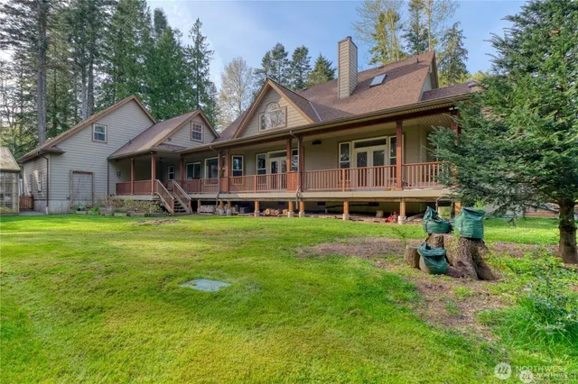an aerial view of a house with a yard basket ball court and outdoor seating