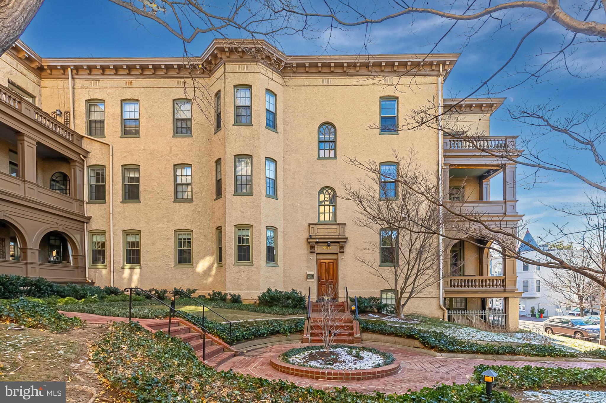a front view of a building with a yard