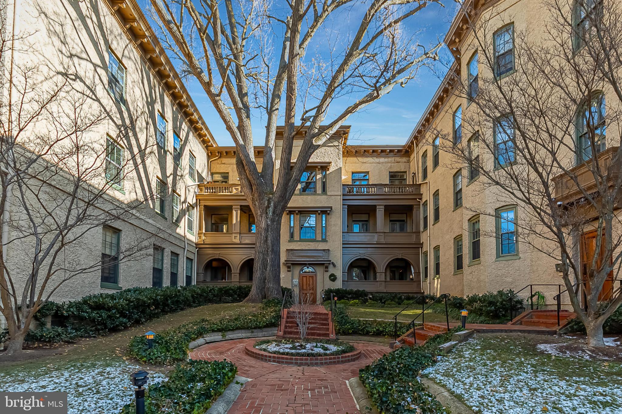 1517 30th Street Northwest, Unit C11 Washington, DC 20007 - Photo 30 of 33 a front view of a house with garden and trees