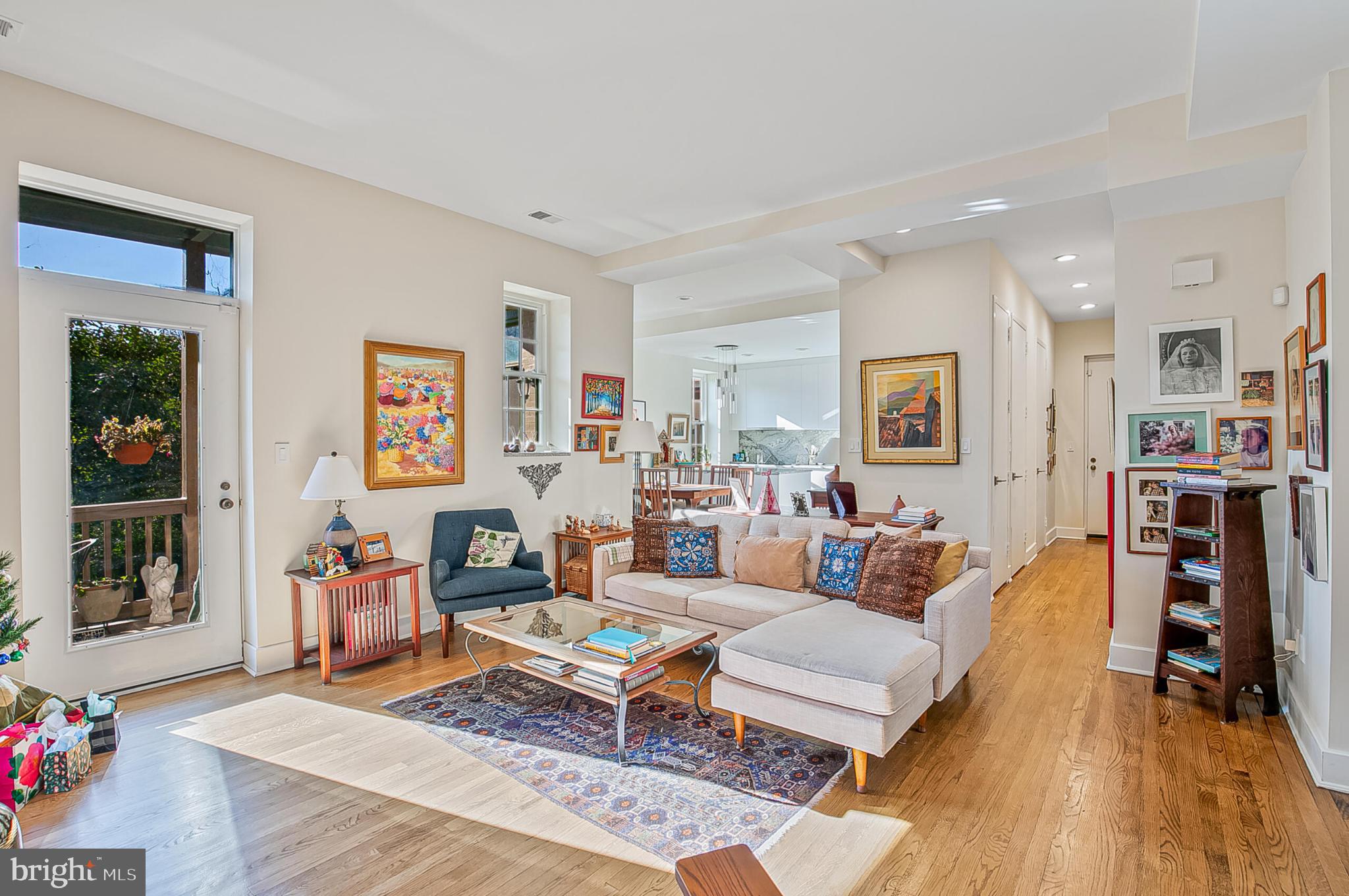 1517 30th Street Northwest, Unit C11 Washington, DC 20007 - Photo 4 of 33 a living room with furniture and a wooden floor