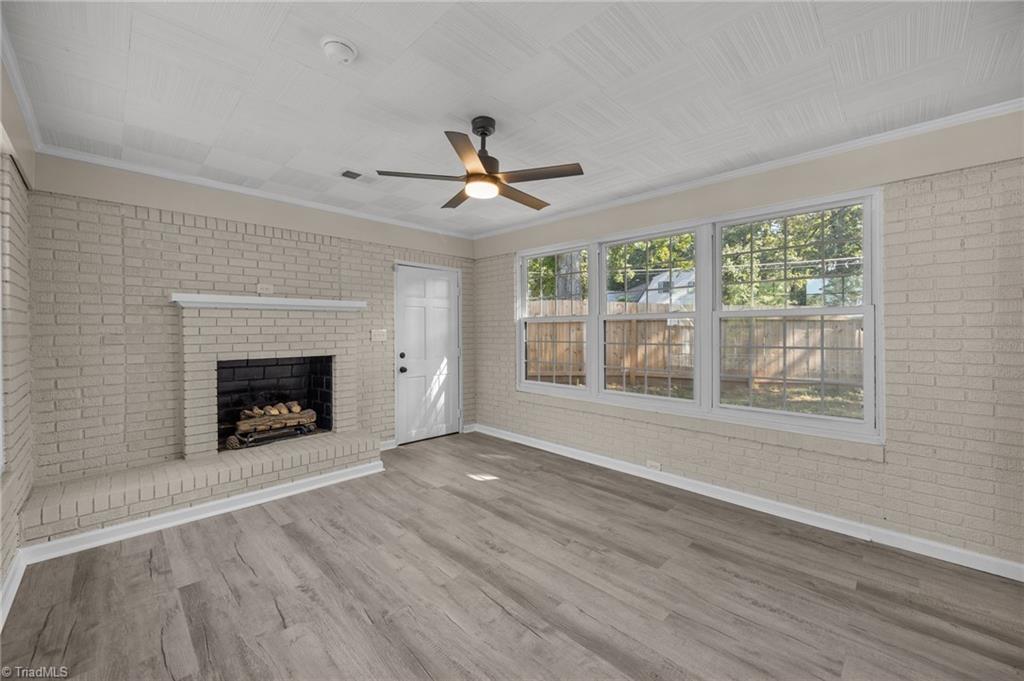 940 North Peace Haven Road Winston-Salem, NC 27104 - Photo 10 of 26 Den off of the kitchen