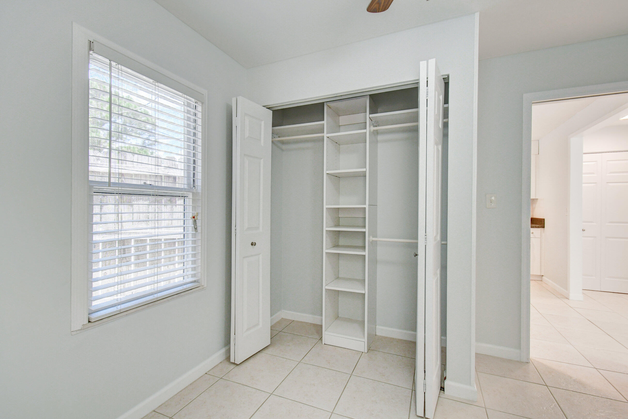4 Gibbs Road, Unit 1 Boynton Beach, FL 33435 - Photo 27 of 43 a view of closet area with window