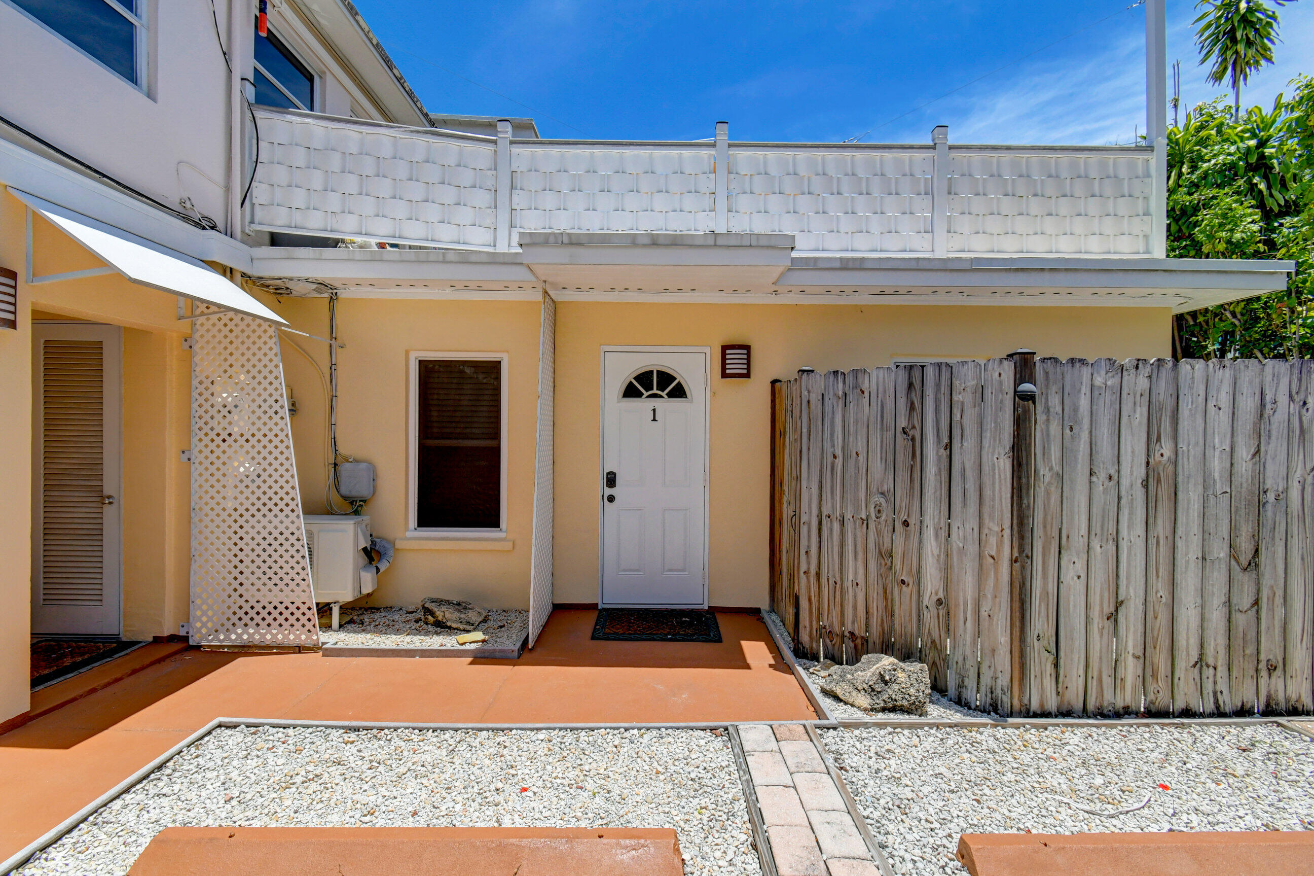 4 Gibbs Road, Unit 1 Boynton Beach, FL 33435 - Photo 3 of 43 a view of a entryway door of the house