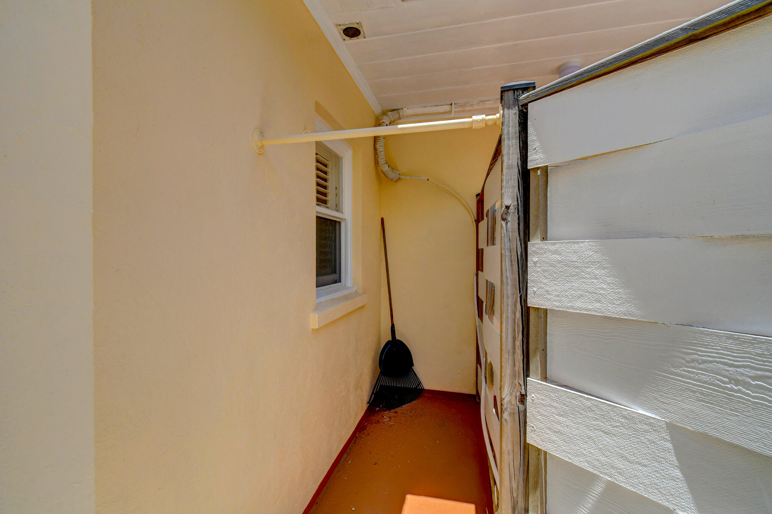 4 Gibbs Road, Unit 1 Boynton Beach, FL 33435 - Photo 36 of 43 a view of walk in closet with clothes and window