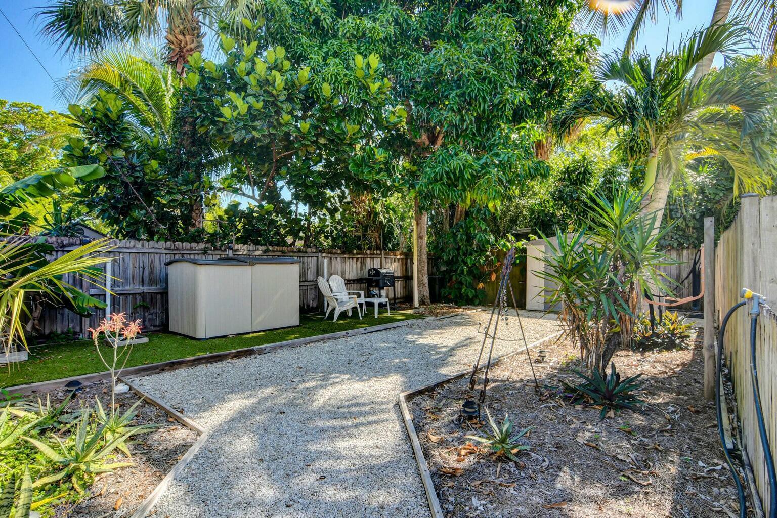 4 Gibbs Road, Unit 1 Boynton Beach, FL 33435 - Photo 38 of 43 a view of a backyard with a tree