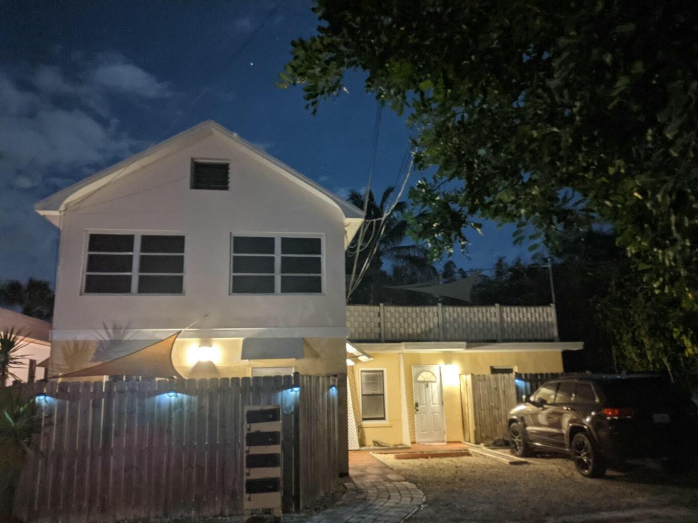 4 Gibbs Road, Unit 1 Boynton Beach, FL 33435 - Photo 43 of 43 a front view of a house with parking
