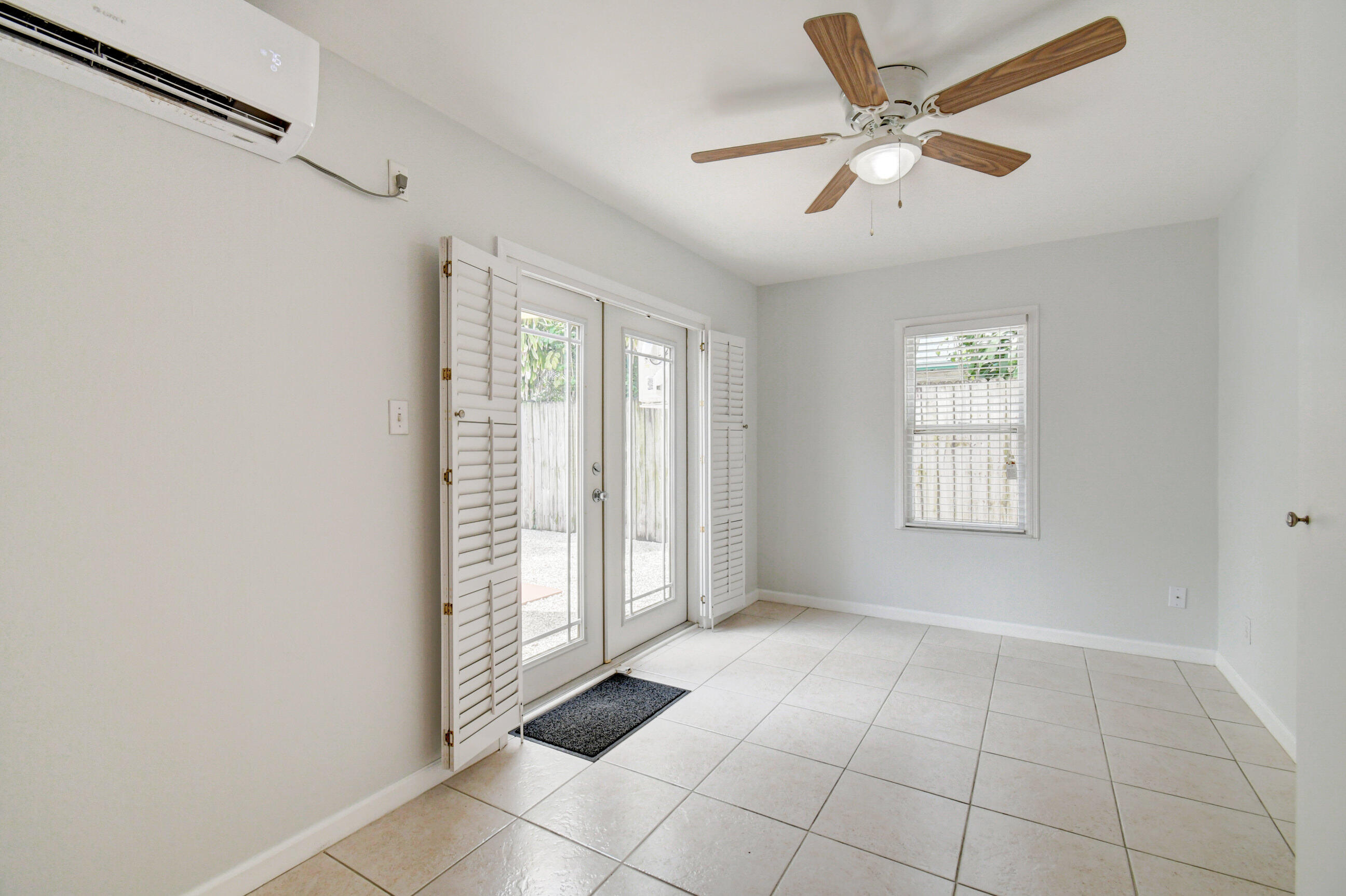 4 Gibbs Road, Unit 1 Boynton Beach, FL 33435 - Photo 6 of 43 a view of an empty room with a window