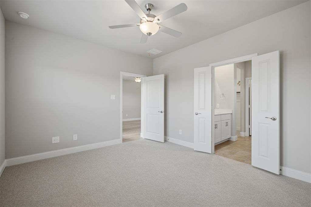 1701 Arches Road Anna, TX 75409 - Photo 9 of 19 Plush carpet flooring, ceiling fan with integrated lighting, recessed lighting, and multiple panel doors