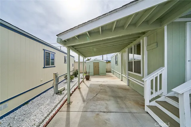 a view of a house with wooden deck