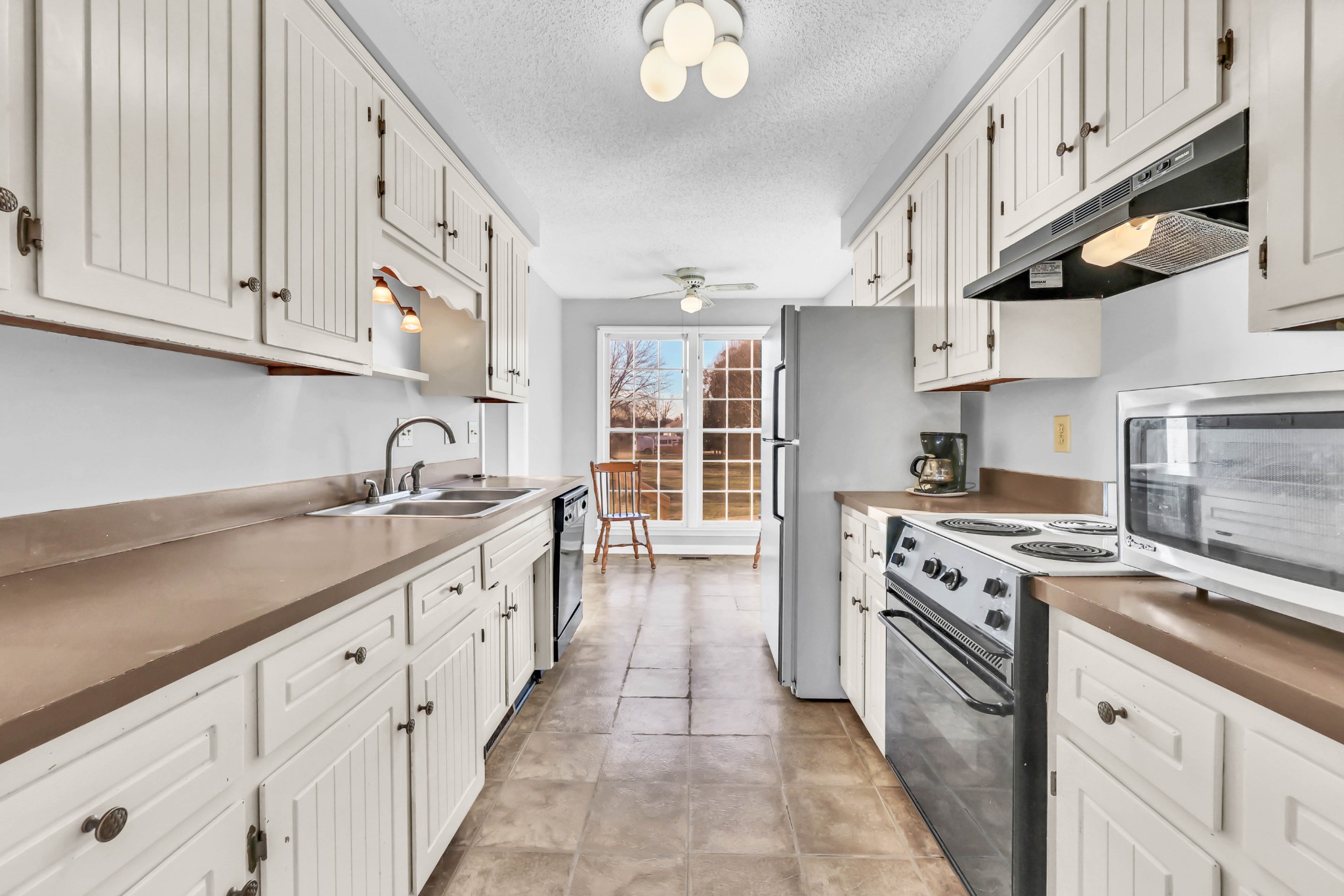 3708 Trenton Road Clarksville, TN 37042 - Photo 13 of 35 a kitchen with stainless steel appliances granite countertop a stove and a sink