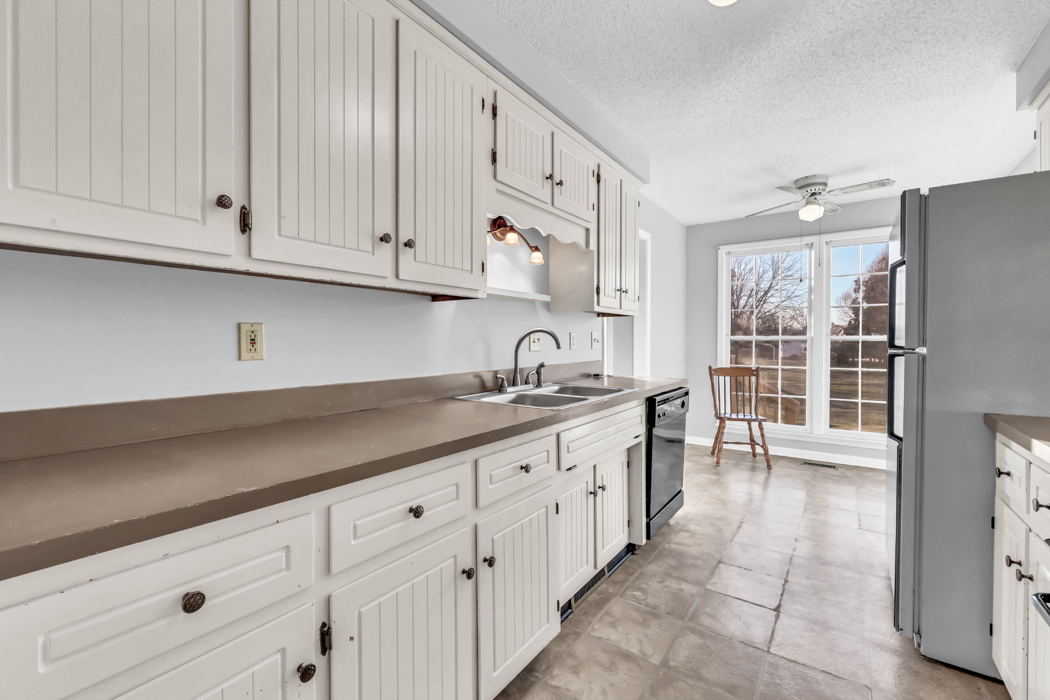 3708 Trenton Road Clarksville, TN 37042 - Photo 14 of 35 a kitchen with granite countertop white cabinets and stainless steel appliances