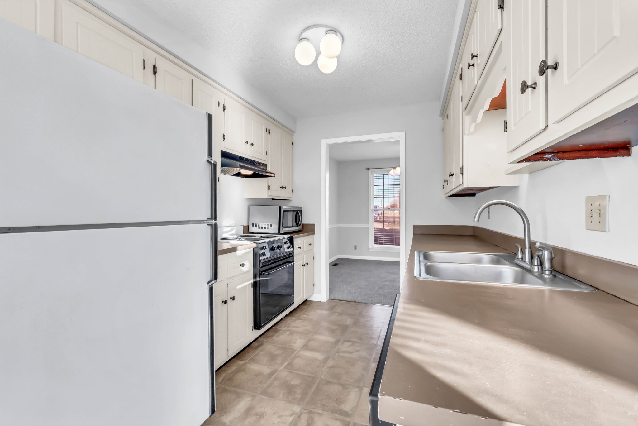 3708 Trenton Road Clarksville, TN 37042 - Photo 15 of 35 a kitchen with stainless steel appliances granite countertop a sink stove and refrigerator