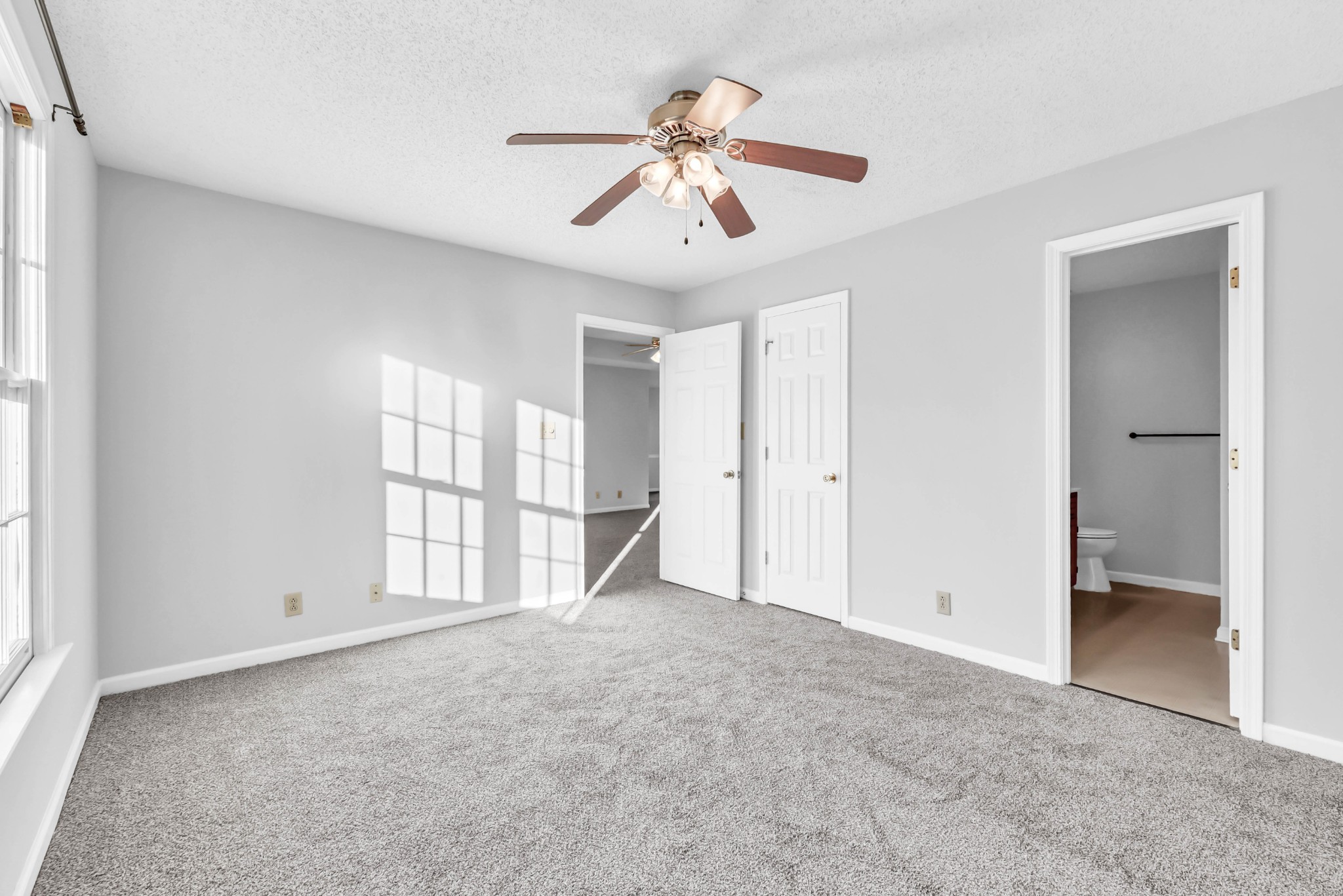3708 Trenton Road Clarksville, TN 37042 - Photo 19 of 35 an empty room with chandelier fan and windows