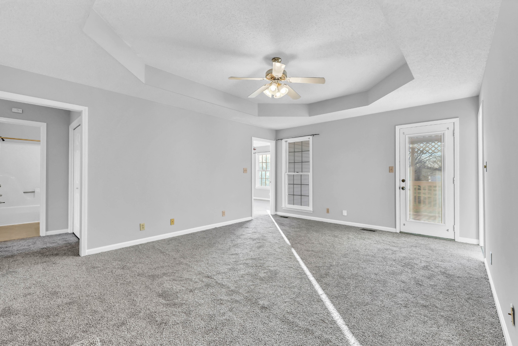 3708 Trenton Road Clarksville, TN 37042 - Photo 9 of 35 an empty room with chandelier fan and windows