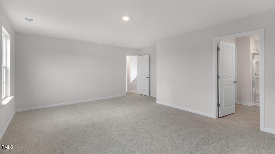 73 Stone Apiary Drive Angier, NC 27501 - Photo 14 of 32 a view of an empty room and a window