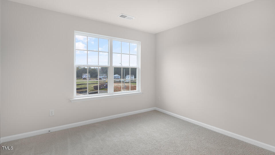 73 Stone Apiary Drive Angier, NC 27501 - Photo 18 of 32 an empty room with a window