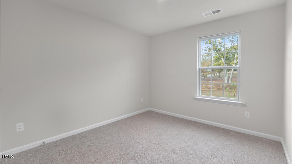 73 Stone Apiary Drive Angier, NC 27501 - Photo 20 of 32 an empty room with a window