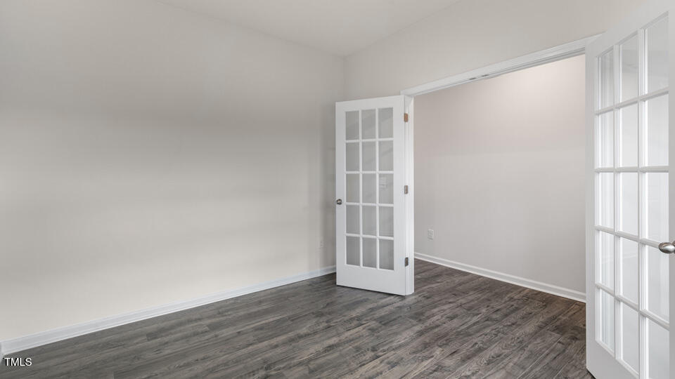 73 Stone Apiary Drive Angier, NC 27501 - Photo 3 of 32 an empty room with wooden floor and windows