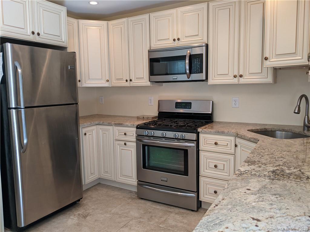 Renovated eat in Kitchen with Granite & stainless appliances