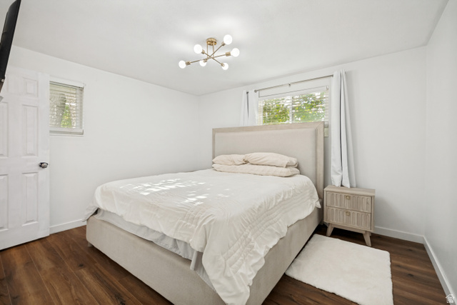 1215 8th Street Ogden, UT 84404 - Photo 13 of 39 Hardwood-style flooring throughout this room, featuring a modern ceiling light fixture