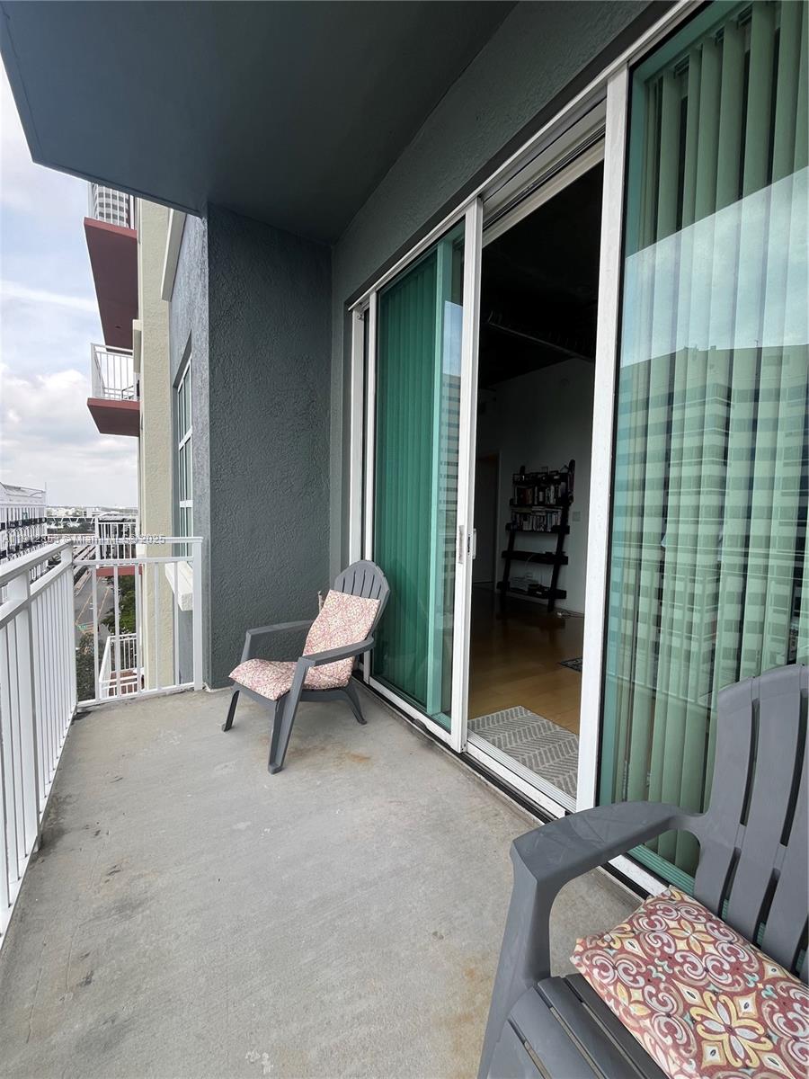 313 Northeast 2nd Street, Unit 802 Fort Lauderdale, FL 33301 - Photo 12 of 12 a living room with furniture and a window