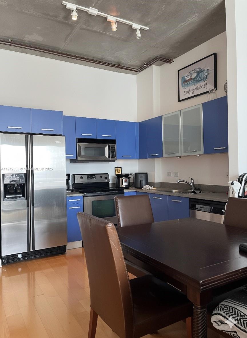 313 Northeast 2nd Street, Unit 802 Fort Lauderdale, FL 33301 - Photo 6 of 12 a kitchen with stainless steel appliances granite countertop a refrigerator a stove a sink and a stove