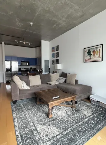 a living room with furniture and a rug