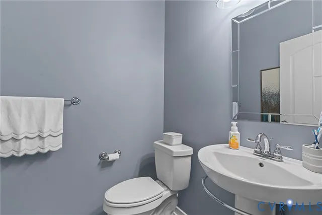 a kitchen with a table chairs refrigerator and window